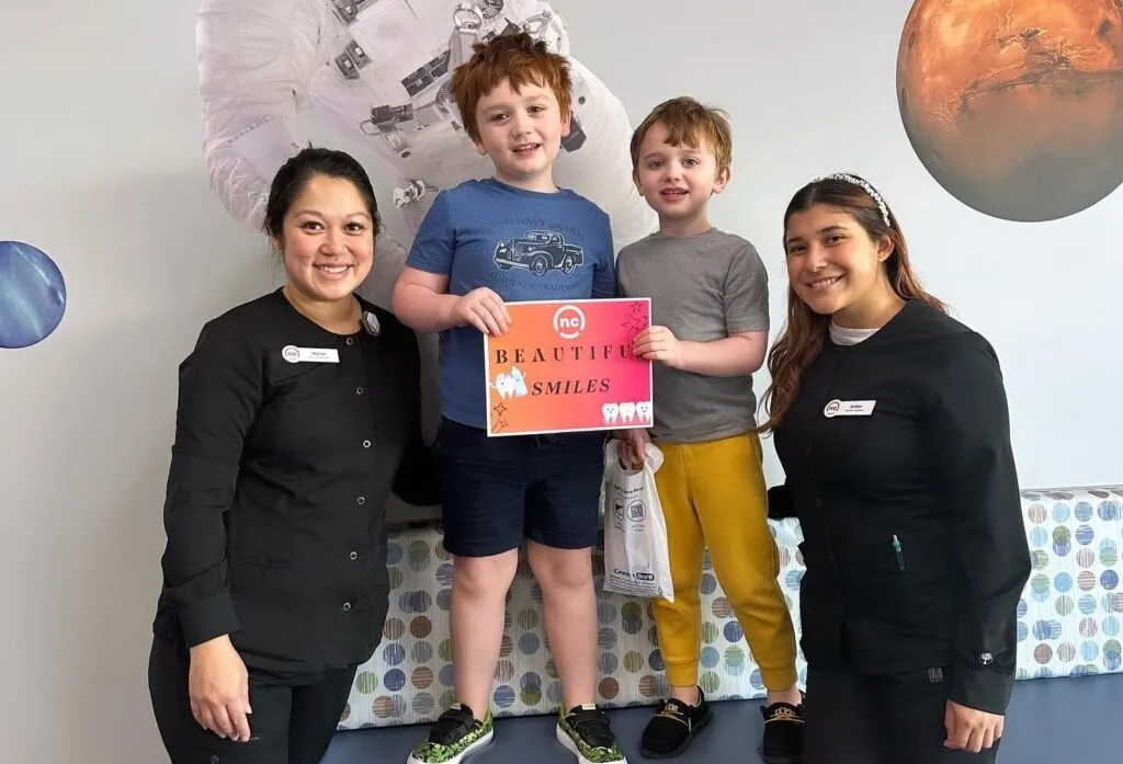 NC Tooth Docs orthodontic team with smiling young visitors at the Huntersville office